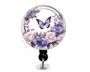 Purple butterfly on floral badge reel.